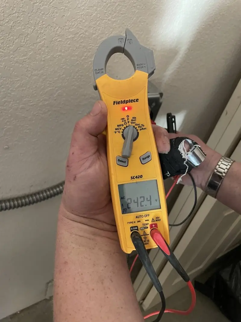Voltage testing with clamp meter during Electrical Installation Services in Buckhead